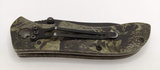 Elk Ridge Logo on Plain Edge Blade Drop Point Green Leaf Camo Handle Pocket Clip